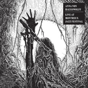 Anna Von Hausswolff - Live at Montreux Jazz Festival Cover art of Anna Von Hausswolff's Live at Montreux Jazz Festival.
It depicts a woman with a raised hand, singing into a microphone.
The art is drawn in black and white.
In the background there is a large iris of an eye, surrounded by roots and branches.
The branches grow into the woman's face.