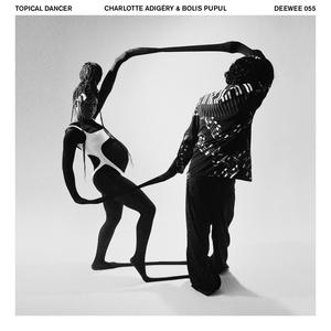 Charlotte Adigéry & Bolis Pupul - Topical Dancer Topical Dancer's cover art.
It depicts Charlotte and Bolis, connected by nylon.
Charlotte is pregnant and looking at the camera, while we can only see Bolis' back.