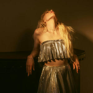 Cover art of Carly Rae Jepsen's The Loveliest Time.
Carly is facing the camera, but her head is tilted fully backwards.
She is wearing a grey skirt and a matching top.
Her hair is long and blonde.