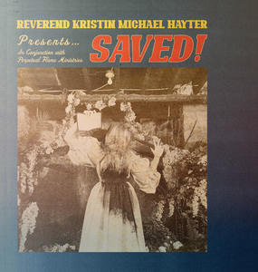 Cover art of Reverend Kristin Michael Hayter's SAVED!.
On the cover there is a black and white picture of a woman in a white, stained dress.
She is holding up a book in a preacher-like way.