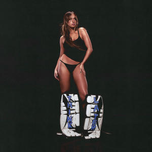 Cover art of Tate McRae's Think Later.
Tate McRae is pictured, wearing a black tank top, Tanga panties and big ice hockey pads (typically worn by goalies).
The words Think Later are written on the pads.